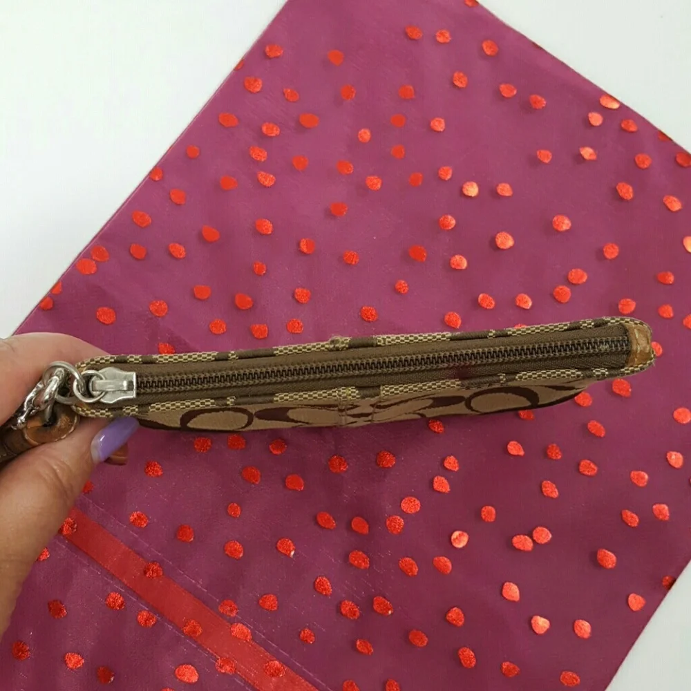 Coach brown canvas wristlet
